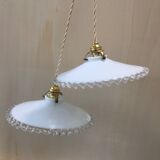 Pair of pendants in white opaline and transparent serrated edges