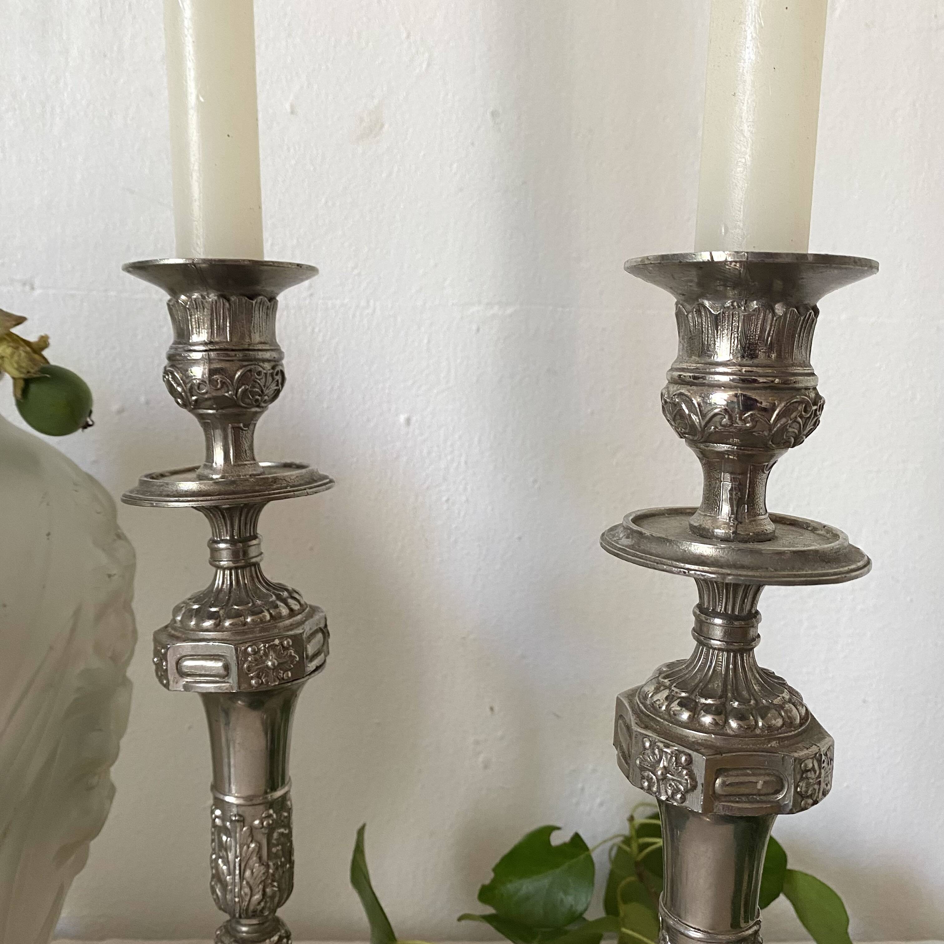 Pair of old silver-plated candlesticks