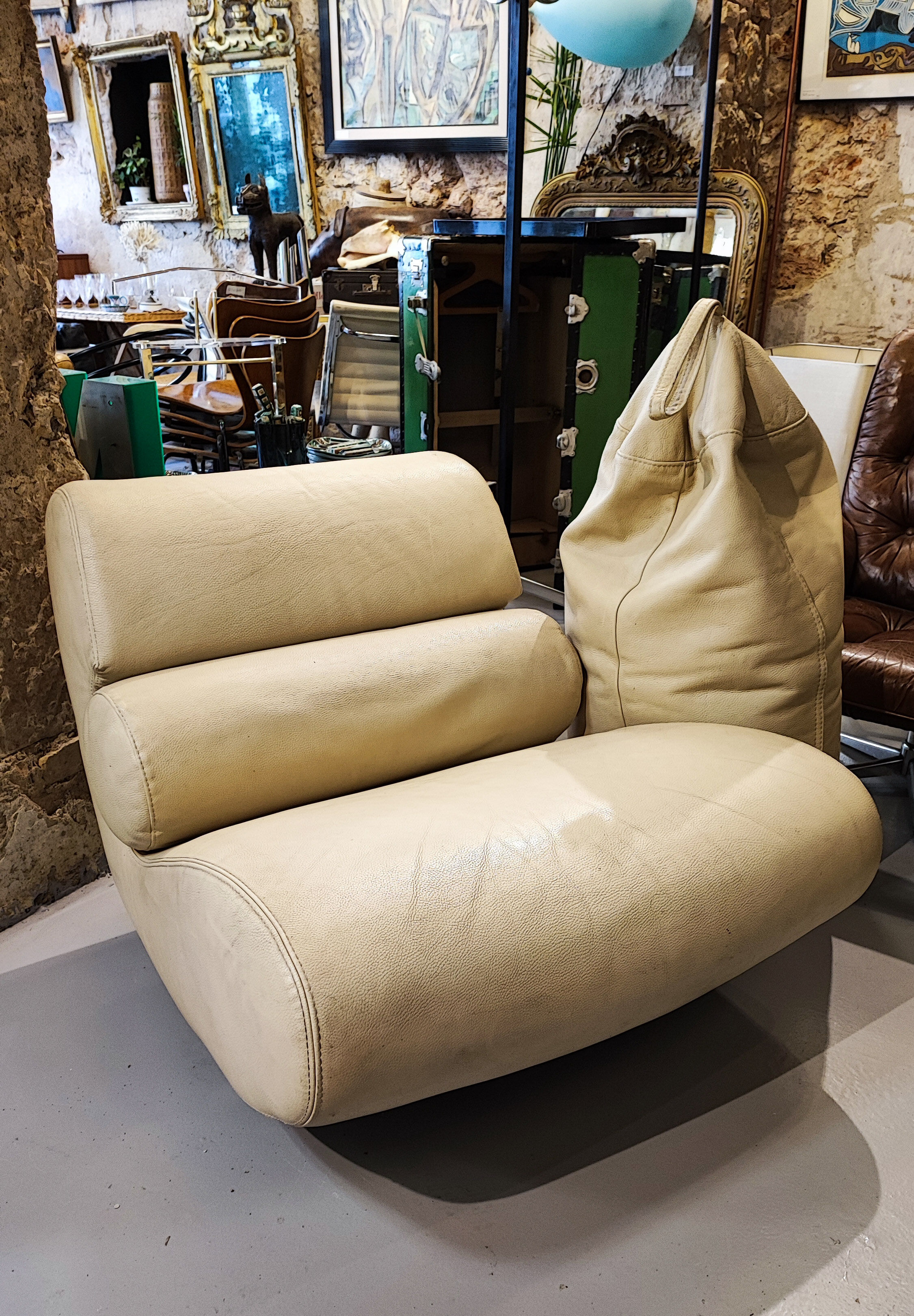 Armchair and footrest Comgule Roche Bobois leather