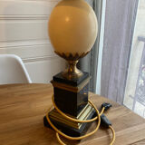 Pair of black marble lamps and ostrich egg