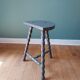 Bluish-grey tripod stool