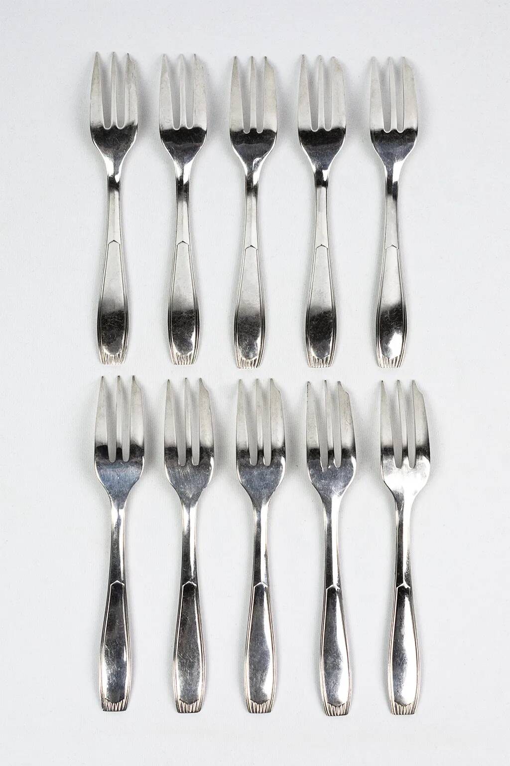 10 Christofle Alfénide Saigon model dessert forks in silver-plated metal.