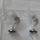 Pair of wall brackets in chromed metal and cut glass