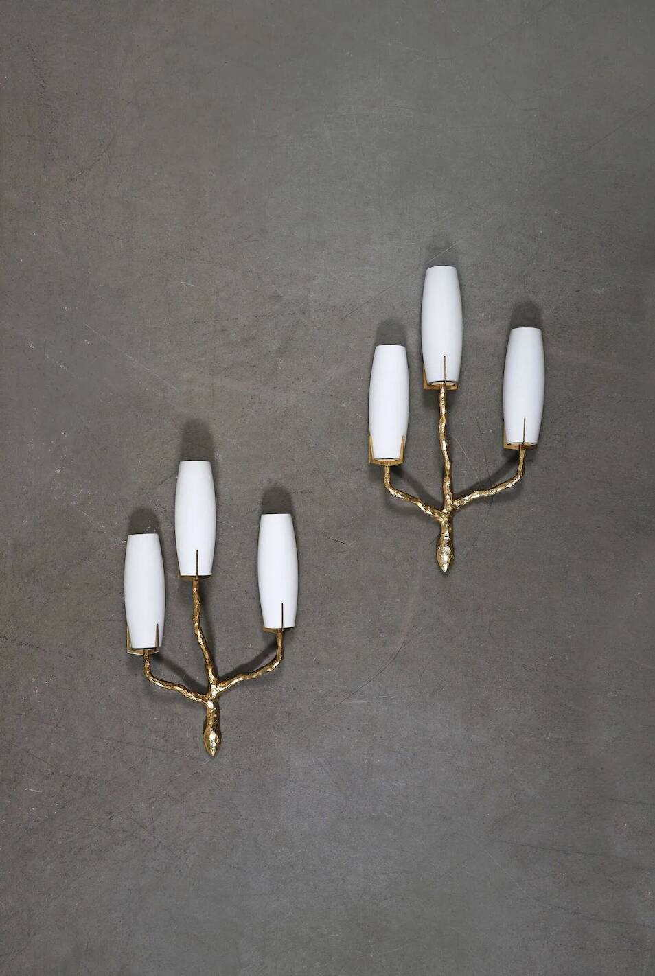 Pair of wall lights by Maison Arlus by Felix Agostini in bronze.