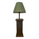 Vintage stone lamp with green pleated shade.