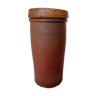 Old sandstone pot with wooden lid