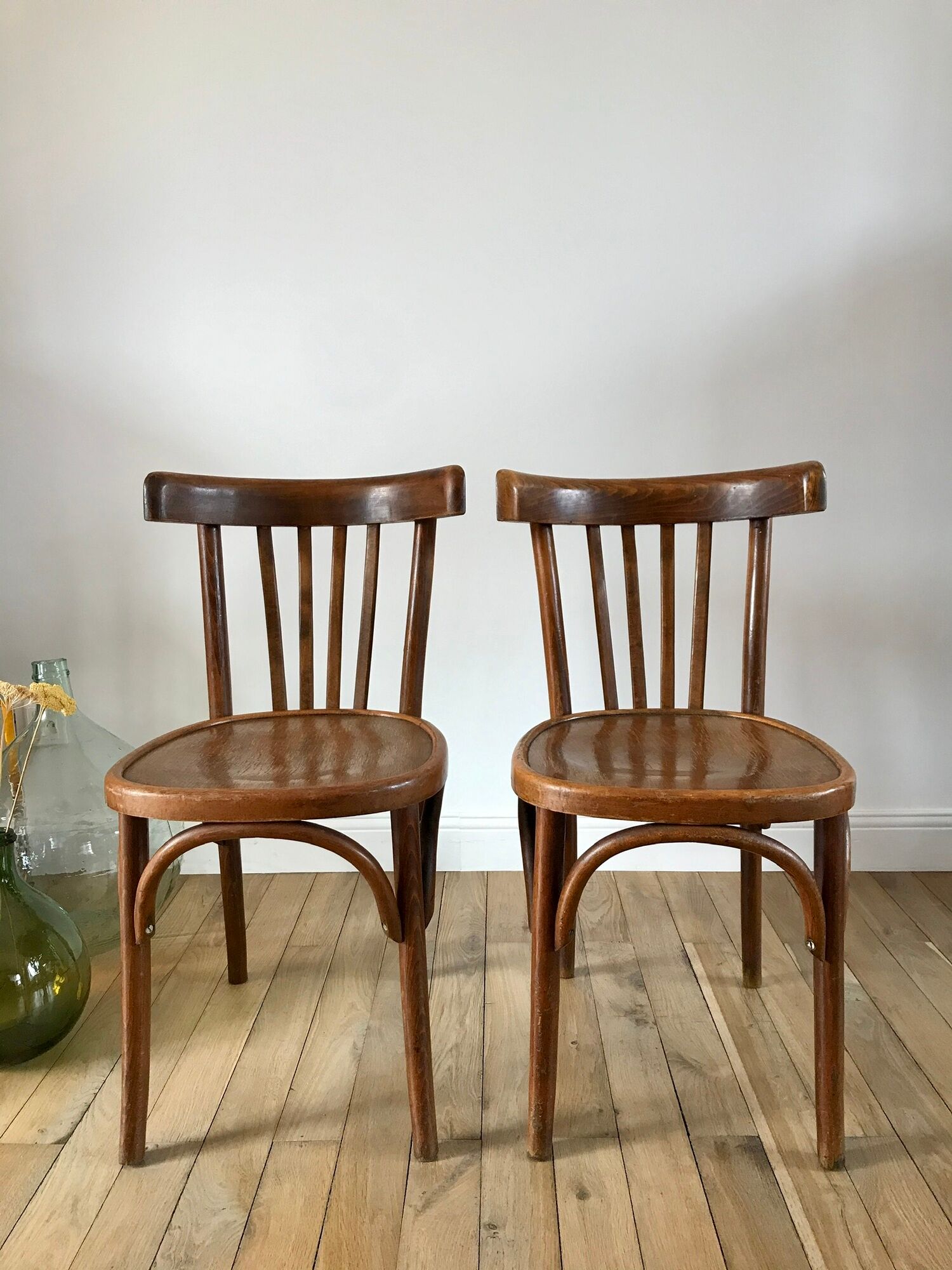 Pair of Baumann curved wood bistro chairs early twentieth century