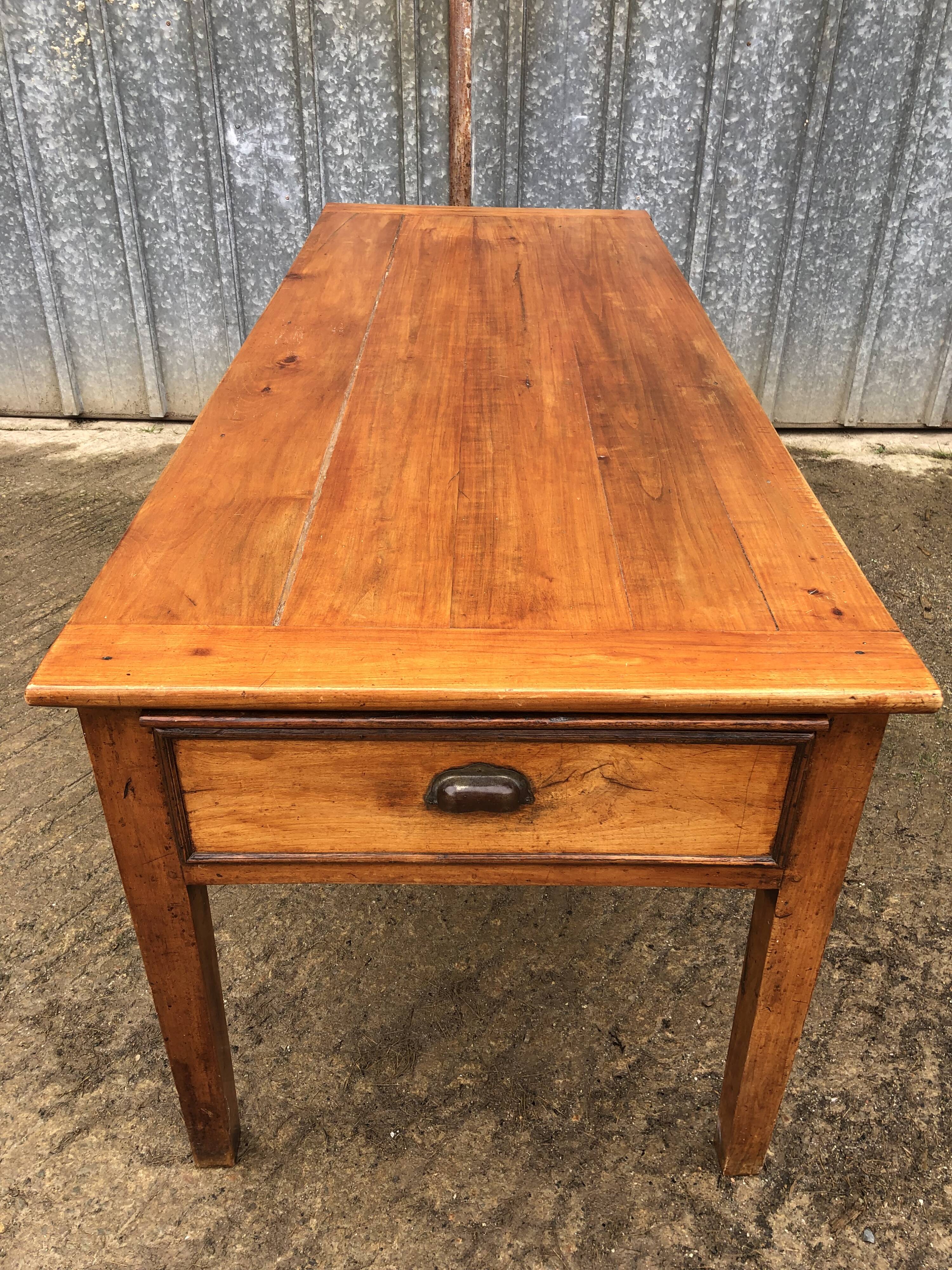 Antique farmhouse table in solid cherry wood with 3 drawers and 1 pull-out.