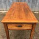 Antique farmhouse table in solid cherry wood with 3 drawers and 1 pull-out.