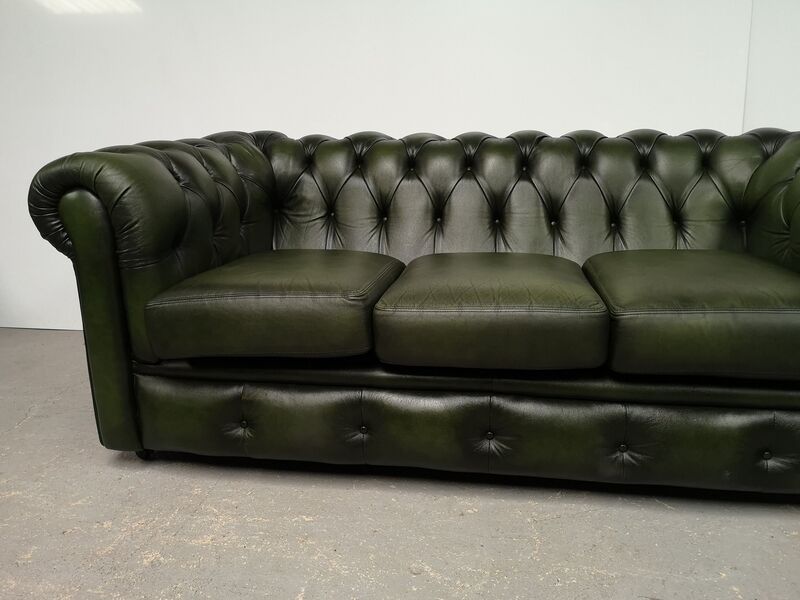 Three-seater green leather Chesterfield sofa