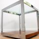 A vintage mid-century glass and rosewood side table by Merrow Associates