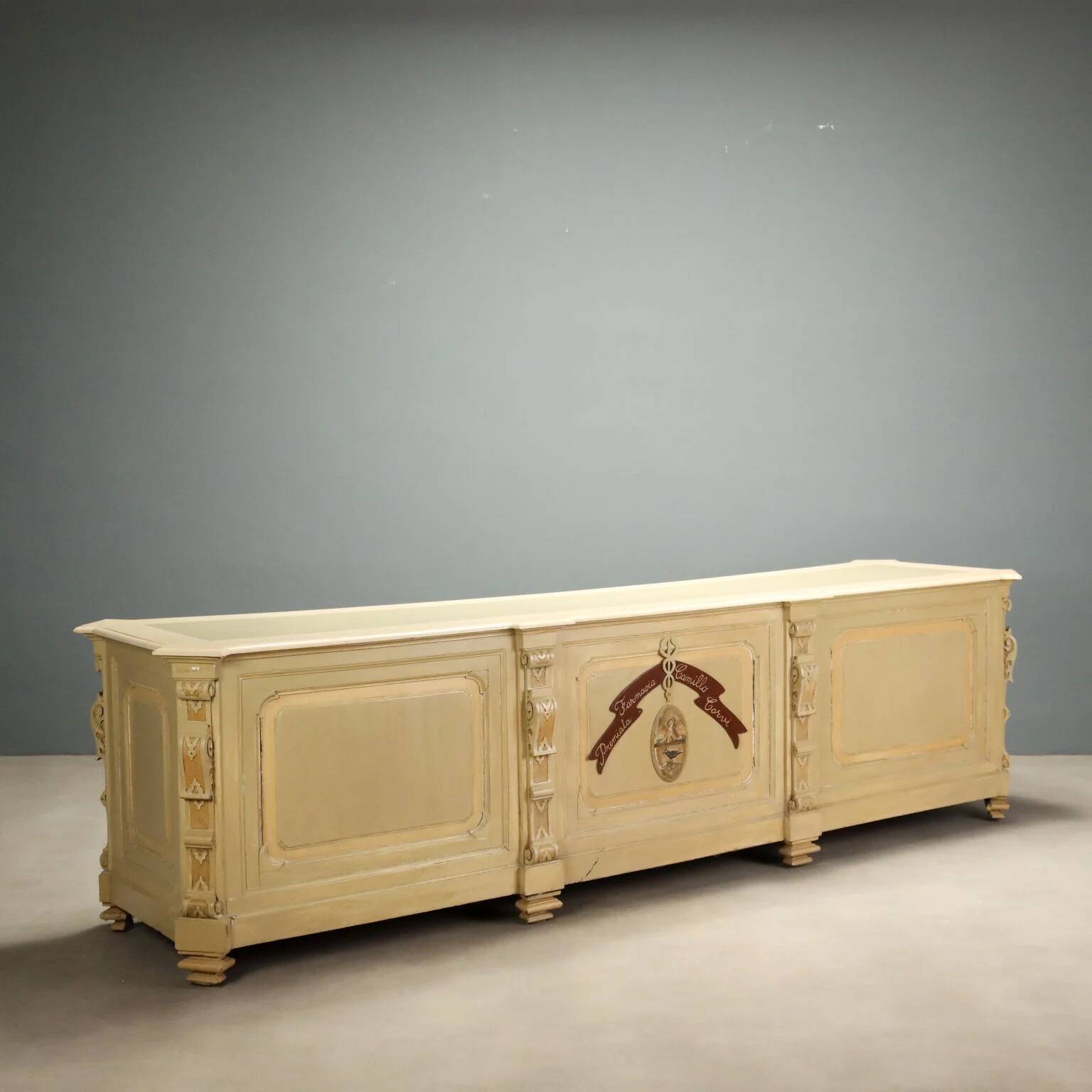 Antique pharmacy counter in lacquered walnut, Italy, late 19th century.
