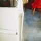 White rattan corner shelf