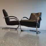 Pair of tubular armchairs