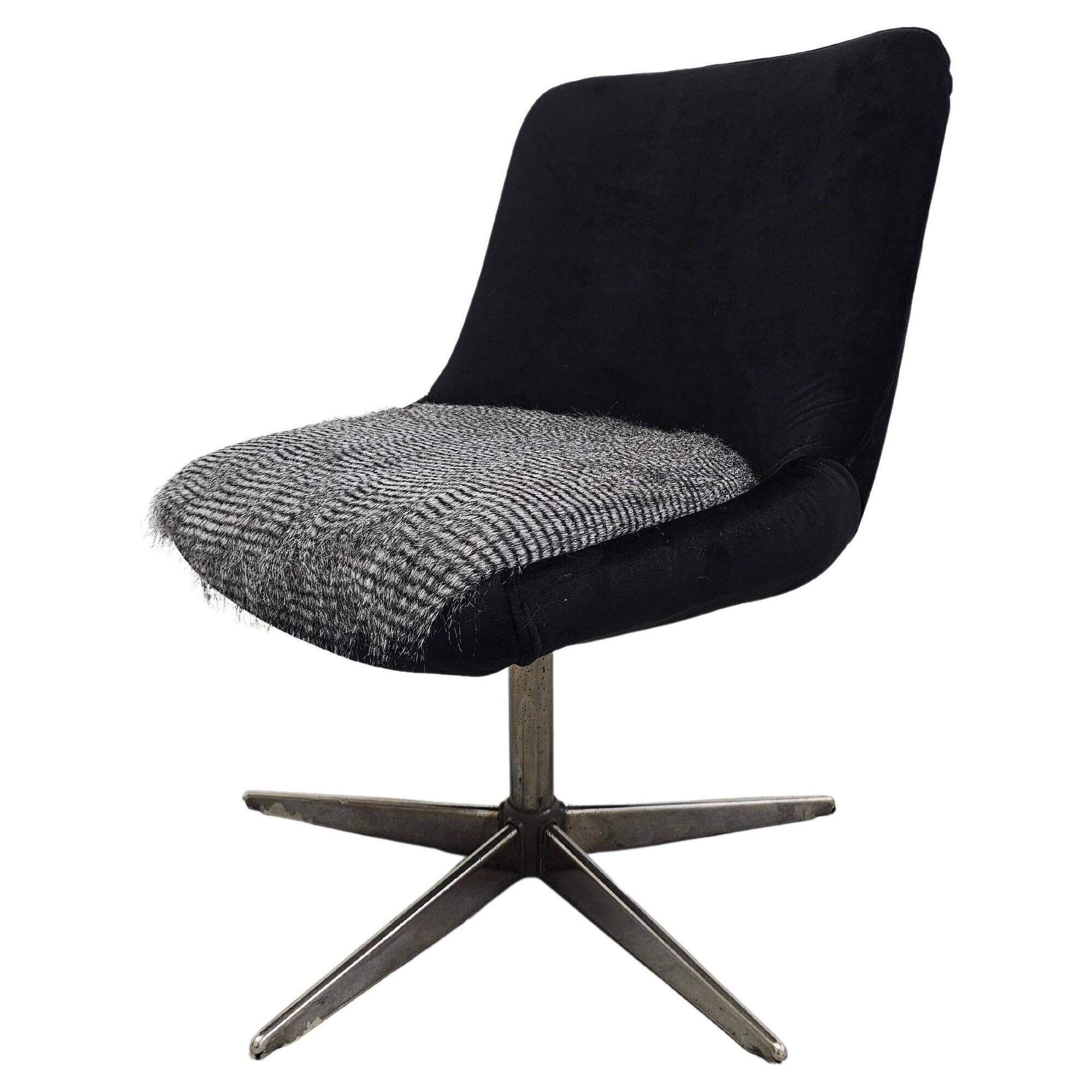 Mid-century redesigned swivel chair in velvet and faux fur.
