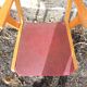 Old wooden and red leatherette bridge chair