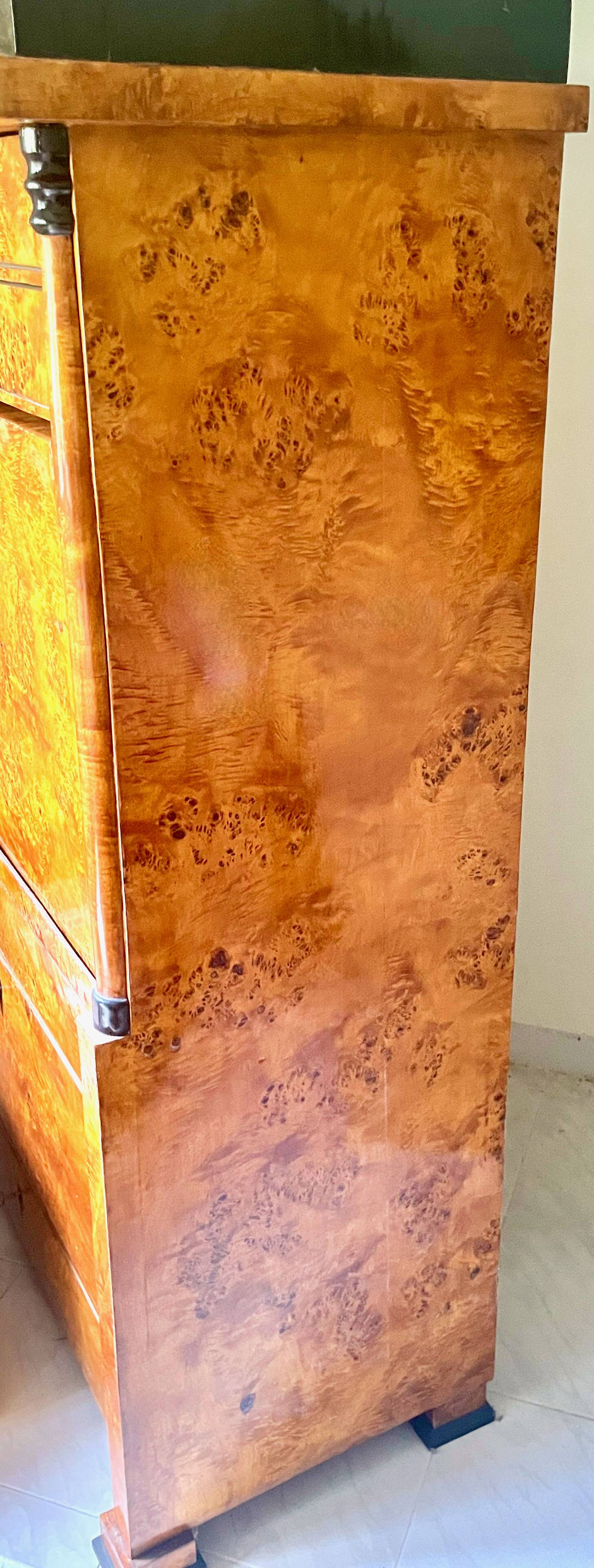 Secretary with a drop-leaf in pine and ebony, in Biedermeier style.