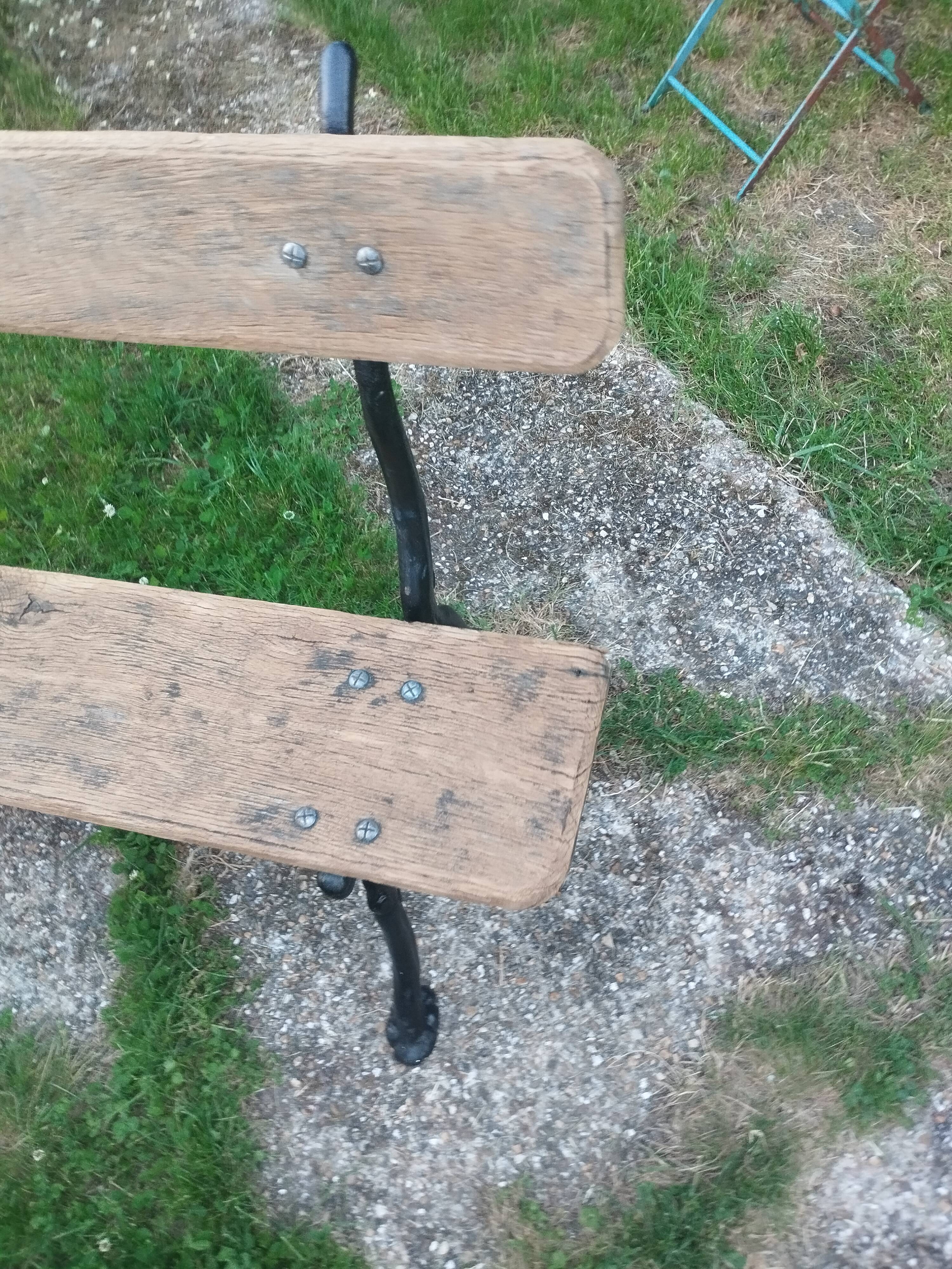 Antique garden bench with cast iron legs