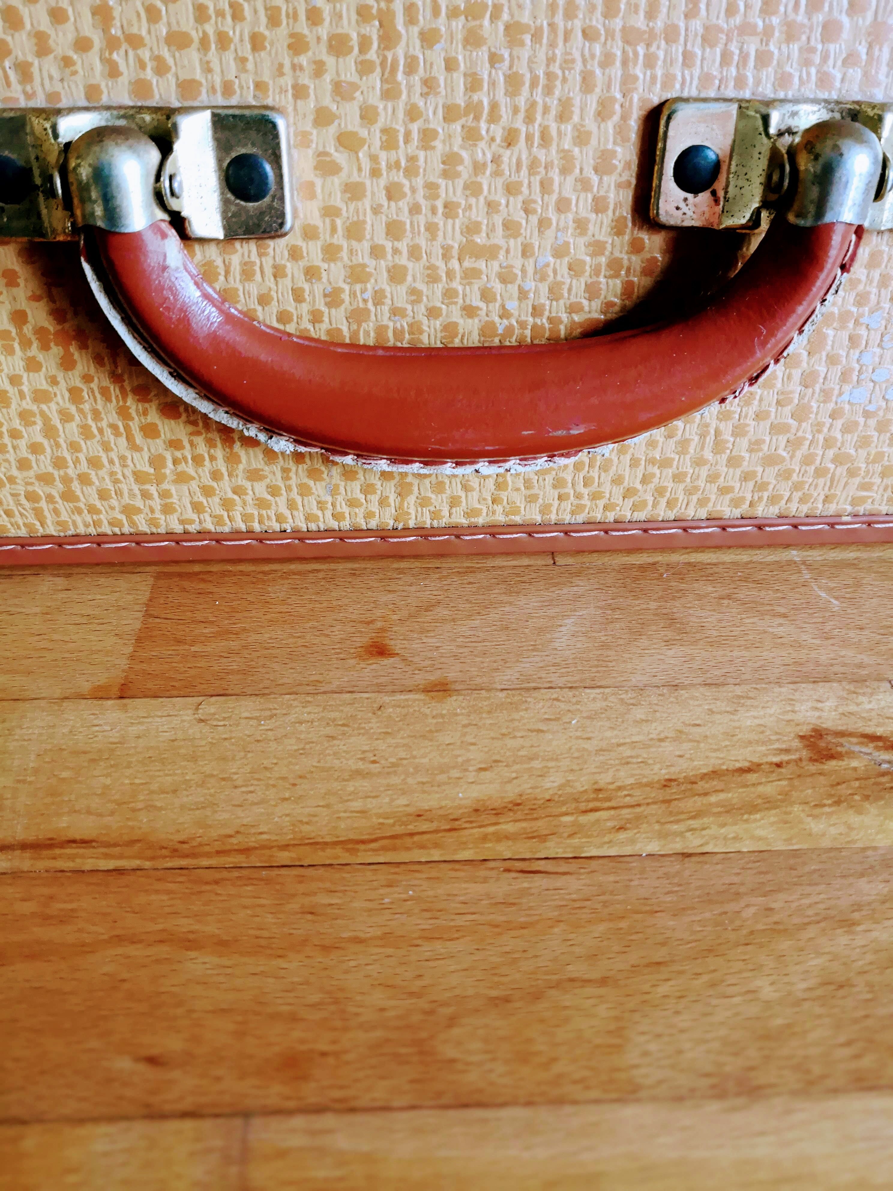 Old suitcase yellow orange