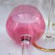 Four colorful stemmed wine glasses