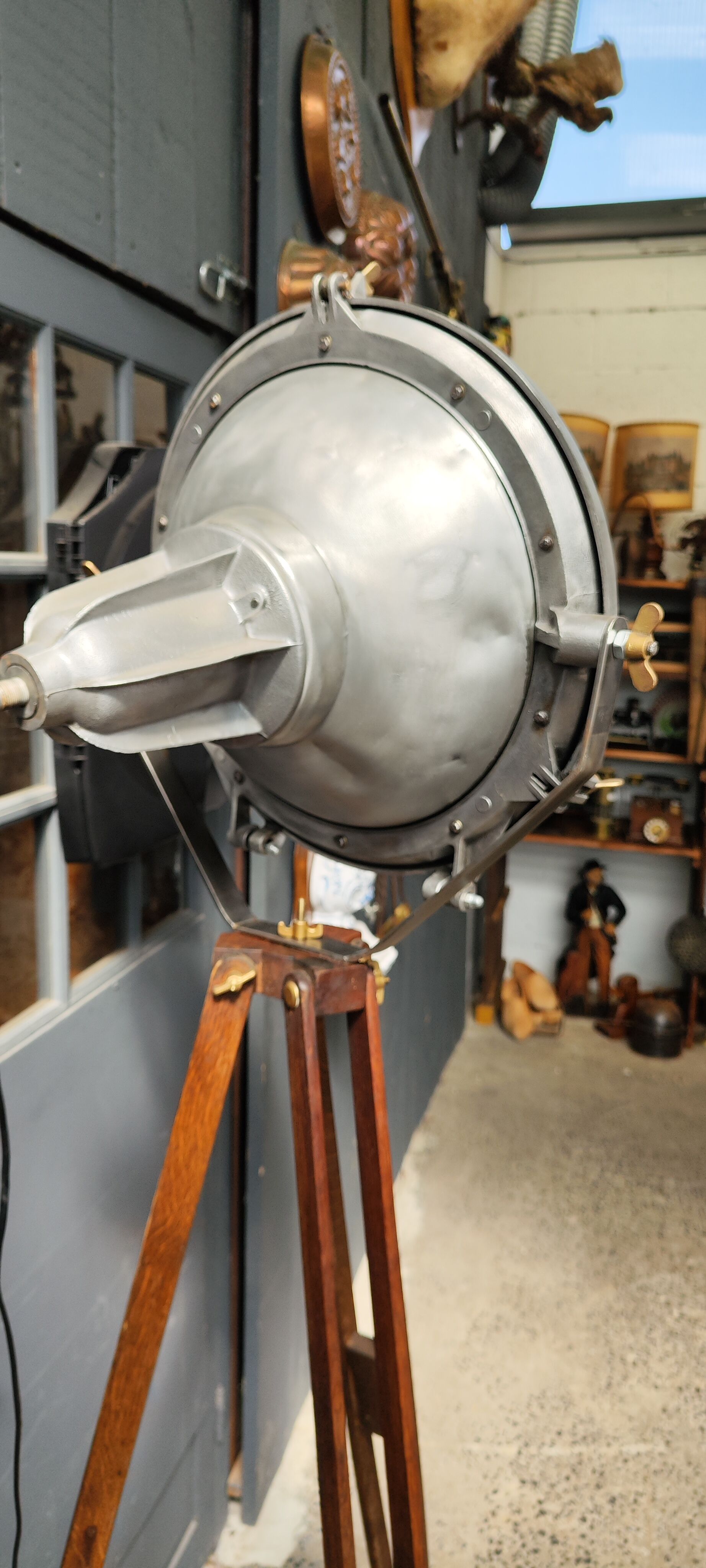 Industrial projector on tripod waxed wood