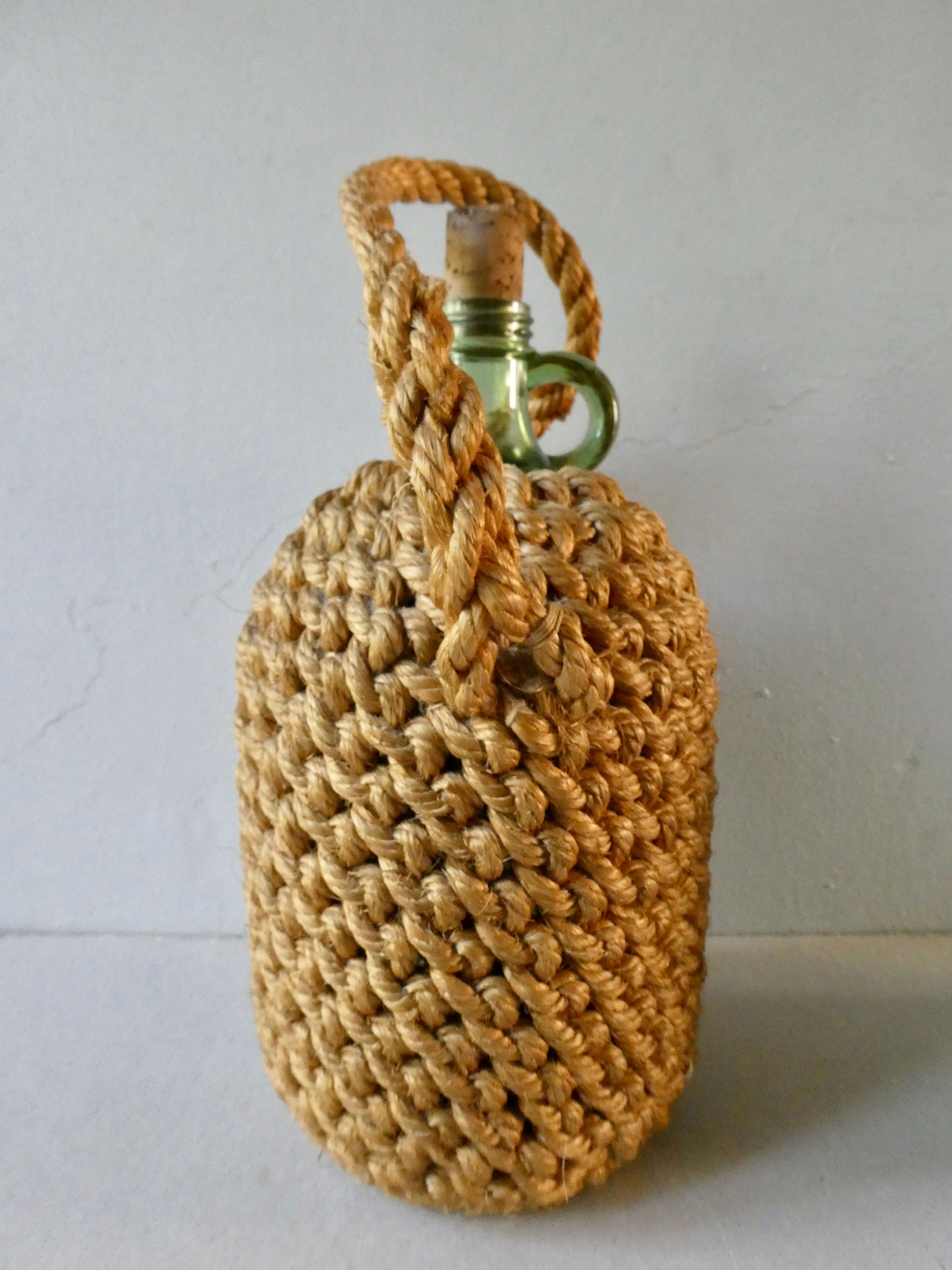 Glass bottle with braided rope, 60s