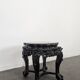 Side table with a wooden frame and marble top.