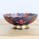 Vintage brass bowl with peacock motif, painted enamel, scalloped edge on a pedestal.