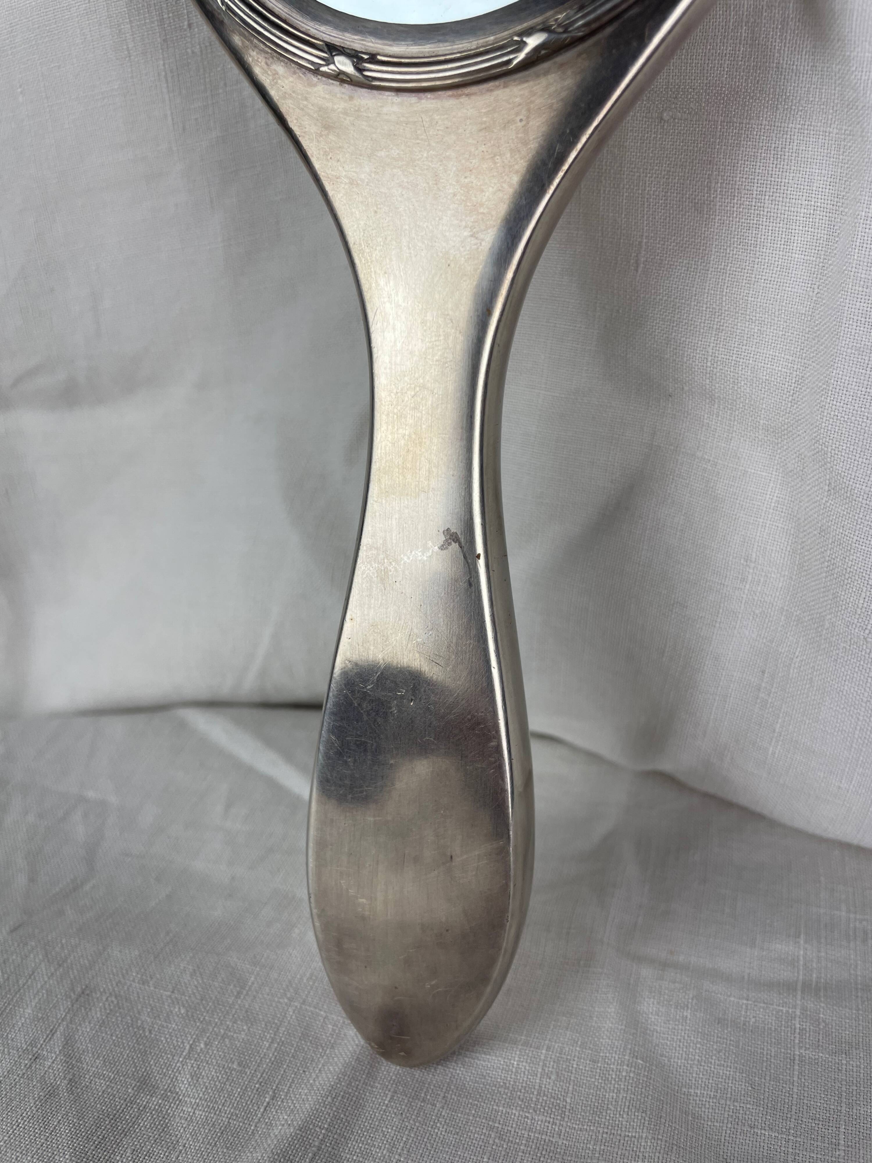 Silver metal hand mirror