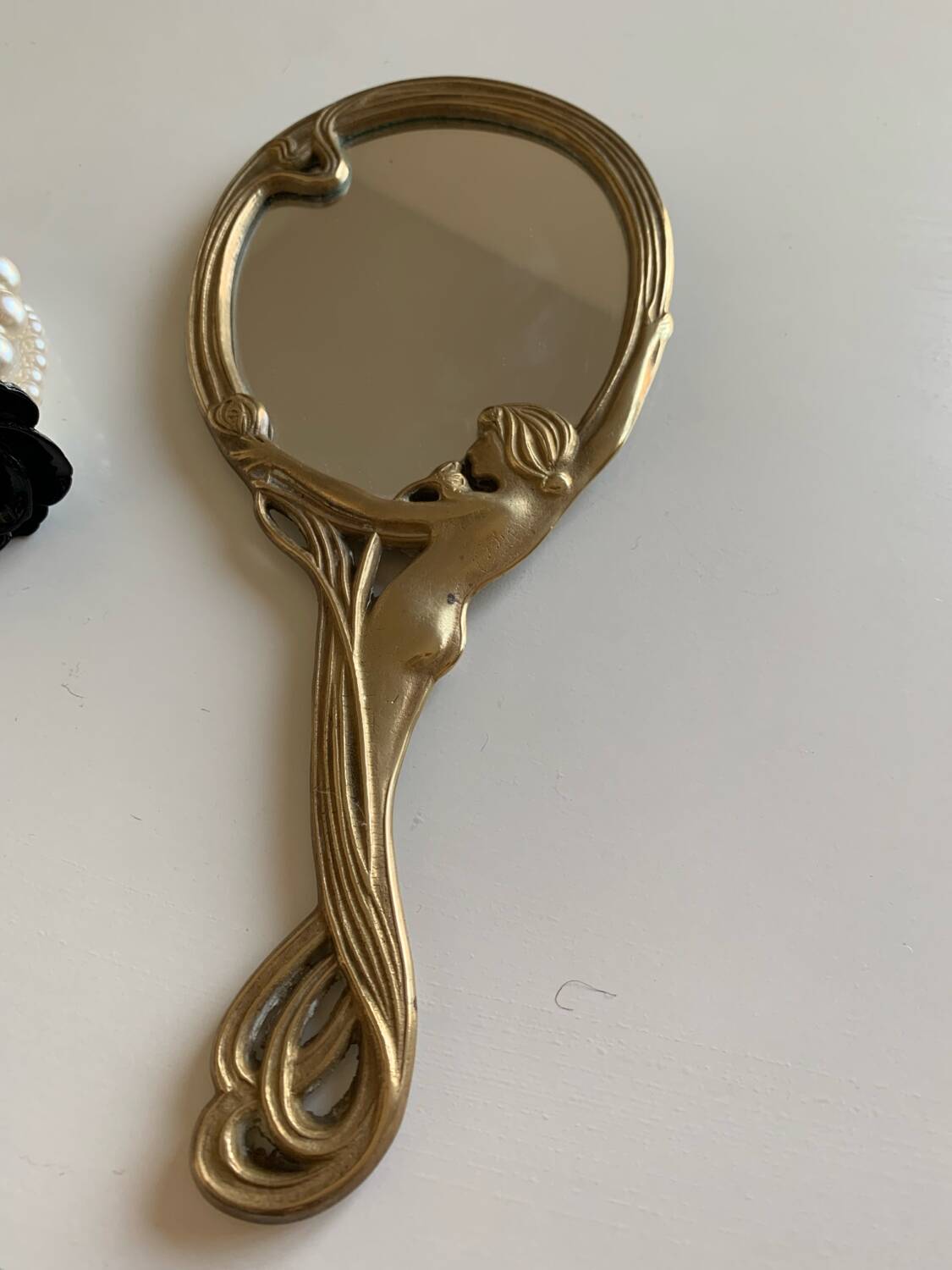 Art Nouveau brass mirror for women