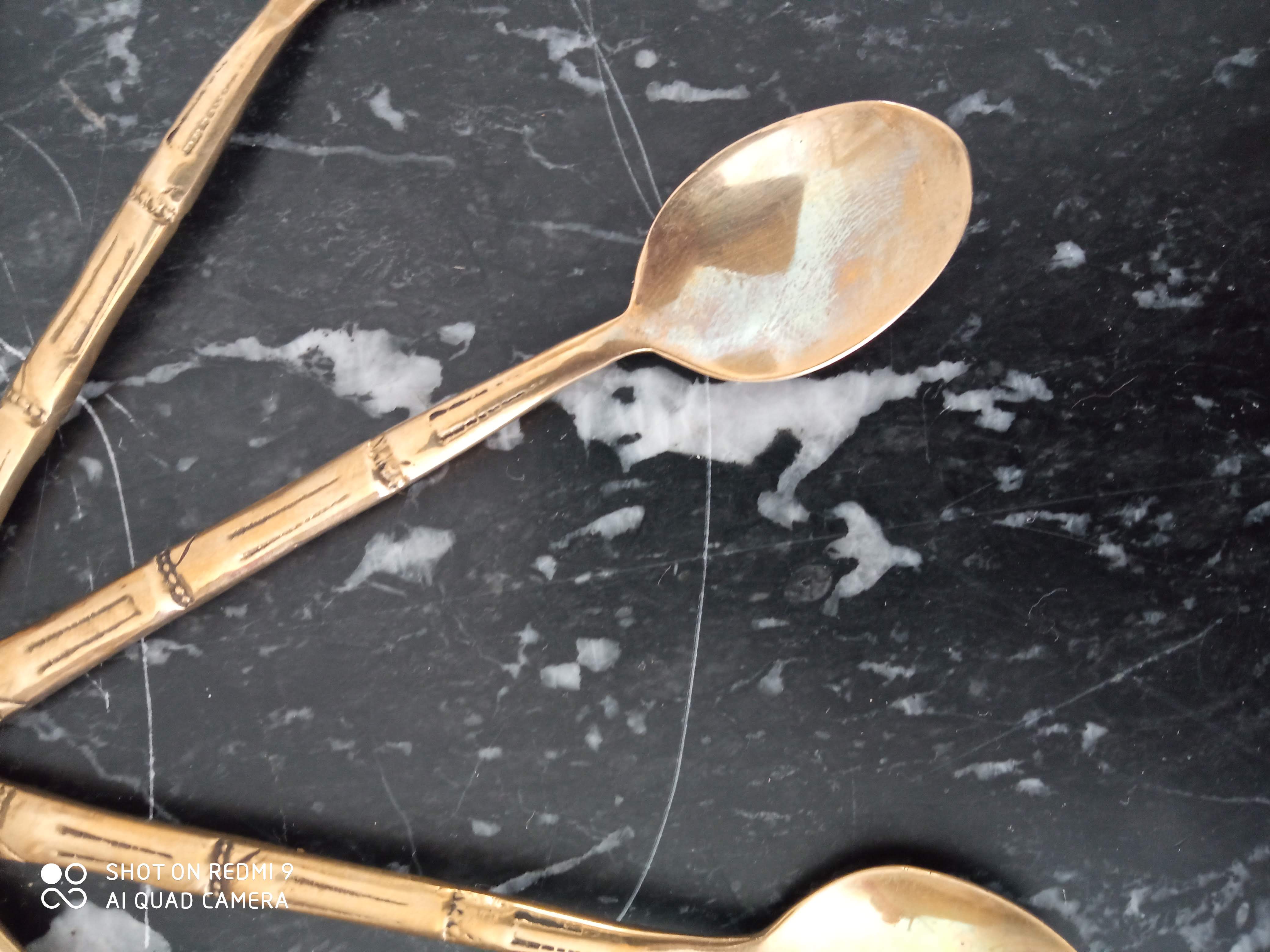 Set of 12 old brass teaspoons