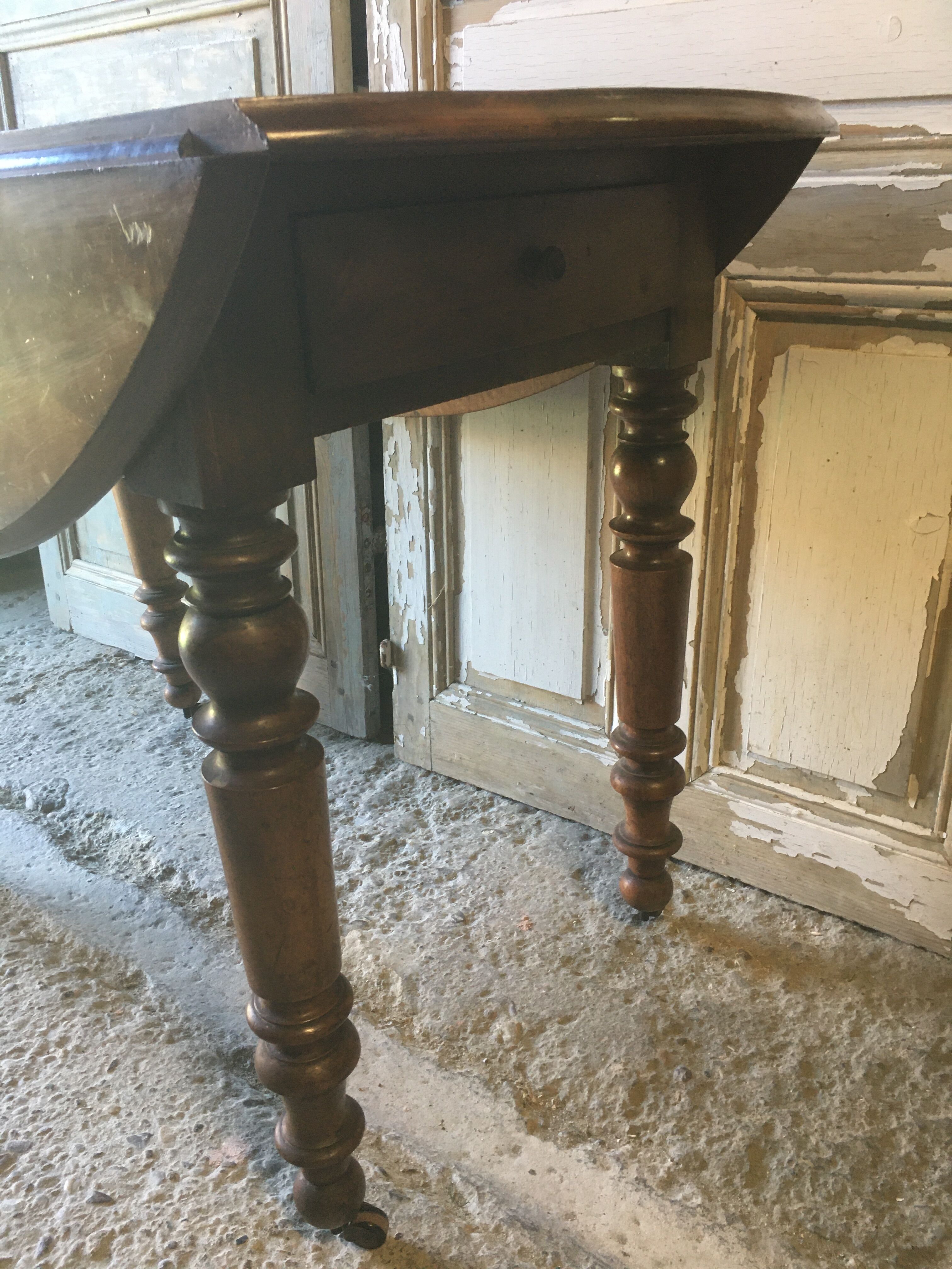 Walnut shutter table with drawer on wheels