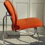 The 1970s orange armchair fabric and chrome metal