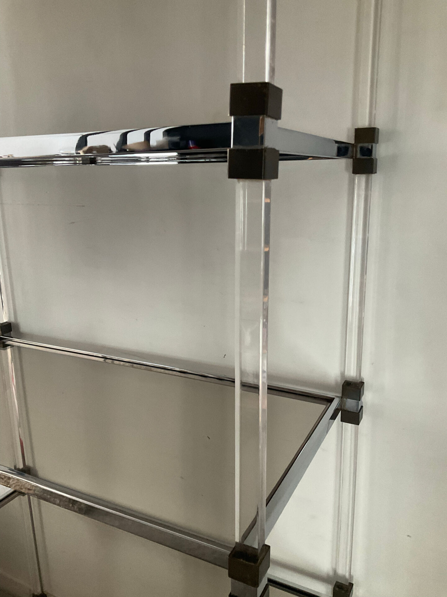 Vintage shelf in lucite, brass, and smoked glass from the 1970s.