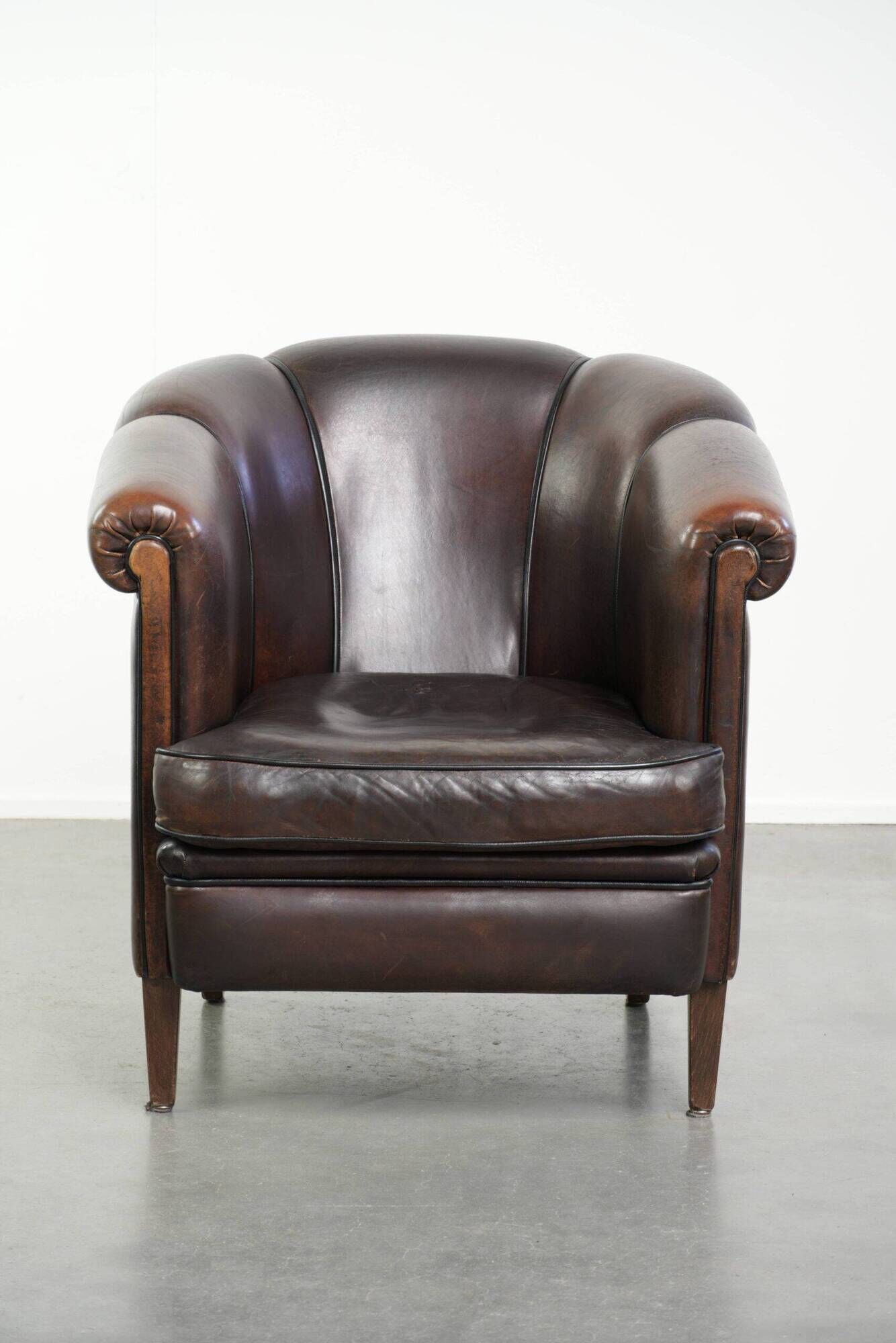 Set of a sheepskin sofa together with its matching club armchair