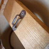 Round mirror on inclined cylindrical support