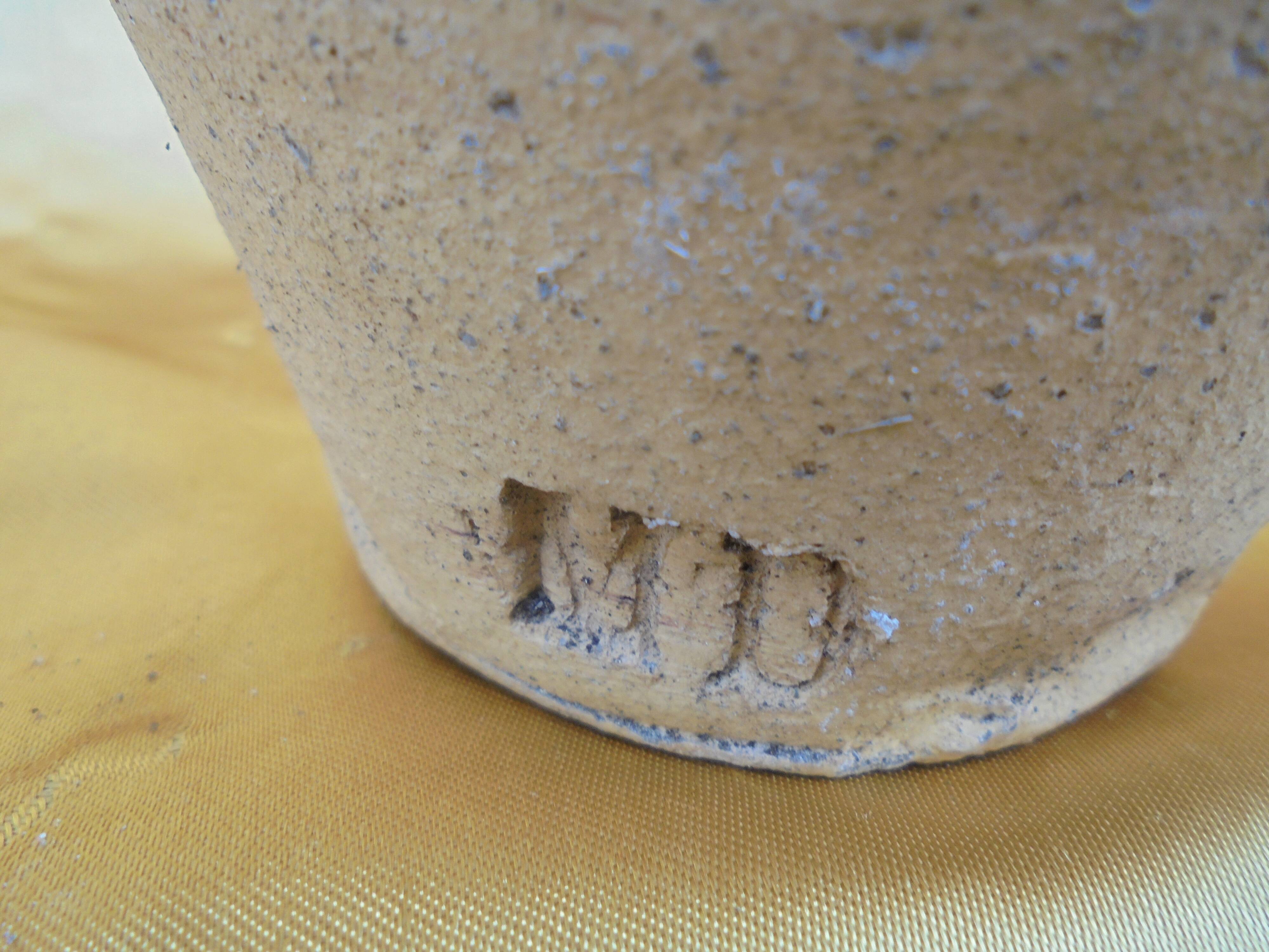 Old terracotta pot with glazed resin