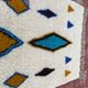 Moroccan Berber rug in cream and blue 250x150 cm – colourful geometric patterns