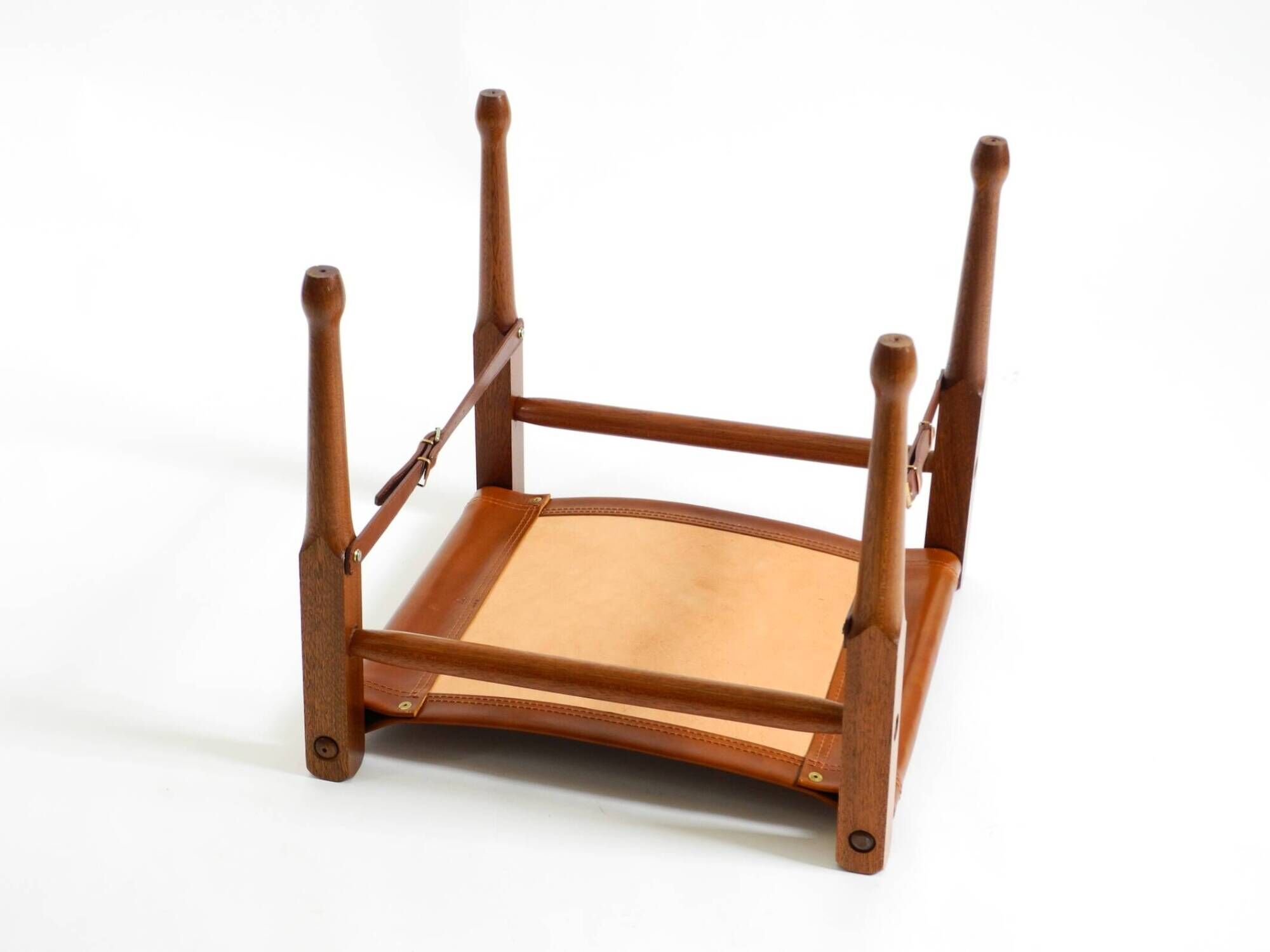 Rare 1990s safari stool with a teak frame and a seat made of brown saddle l