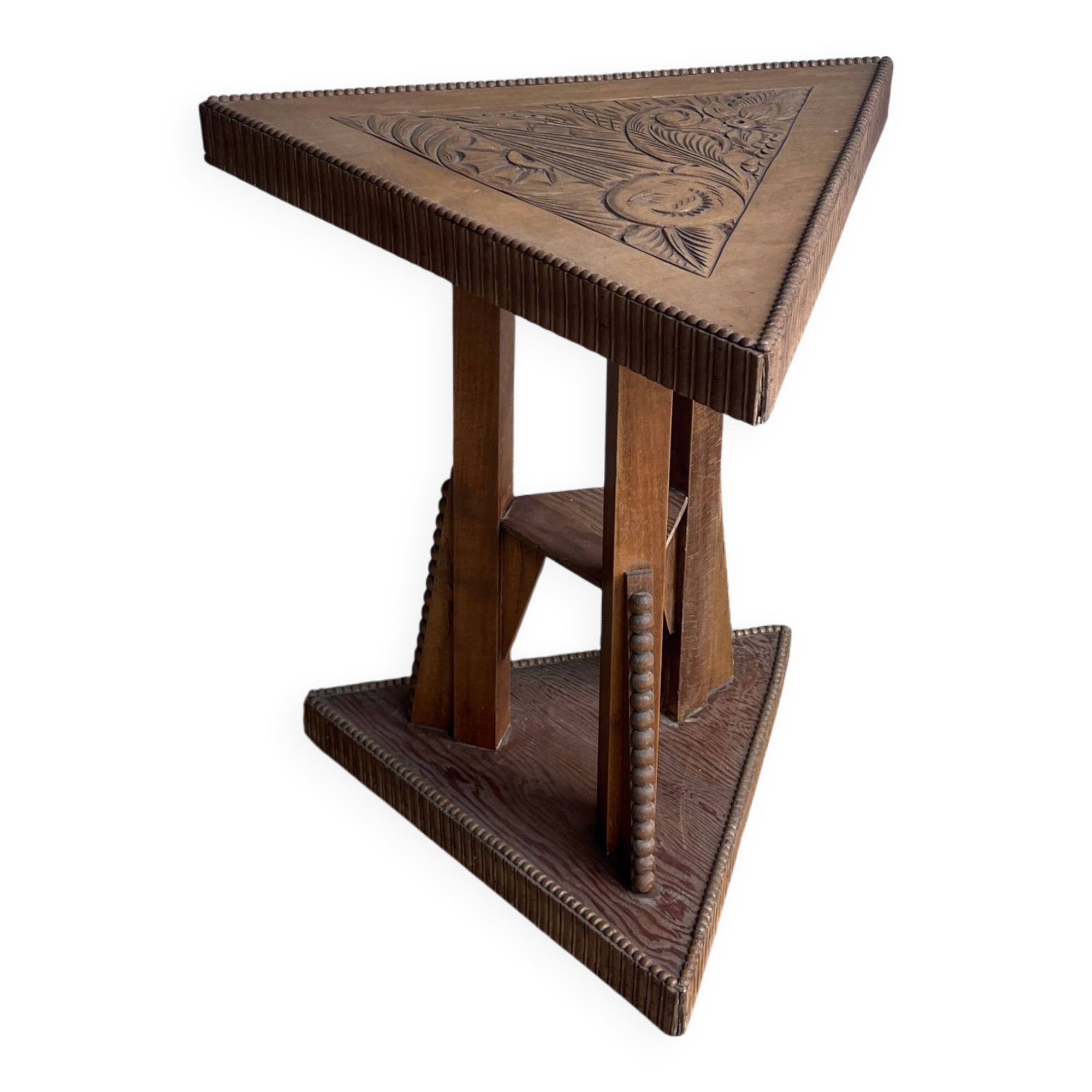 Triangular side table in carved wood, Art Nouveau, France, circa 1915.