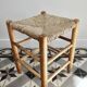 Vintage low stool in wood, honey yellow tones – Woven seat