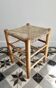 Vintage low stool in wood, honey yellow tones – Woven seat