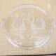 Vintage glass cake stand with swan decoration.