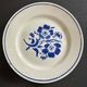 Set of 6 vintage dessert plates with blue patterns.