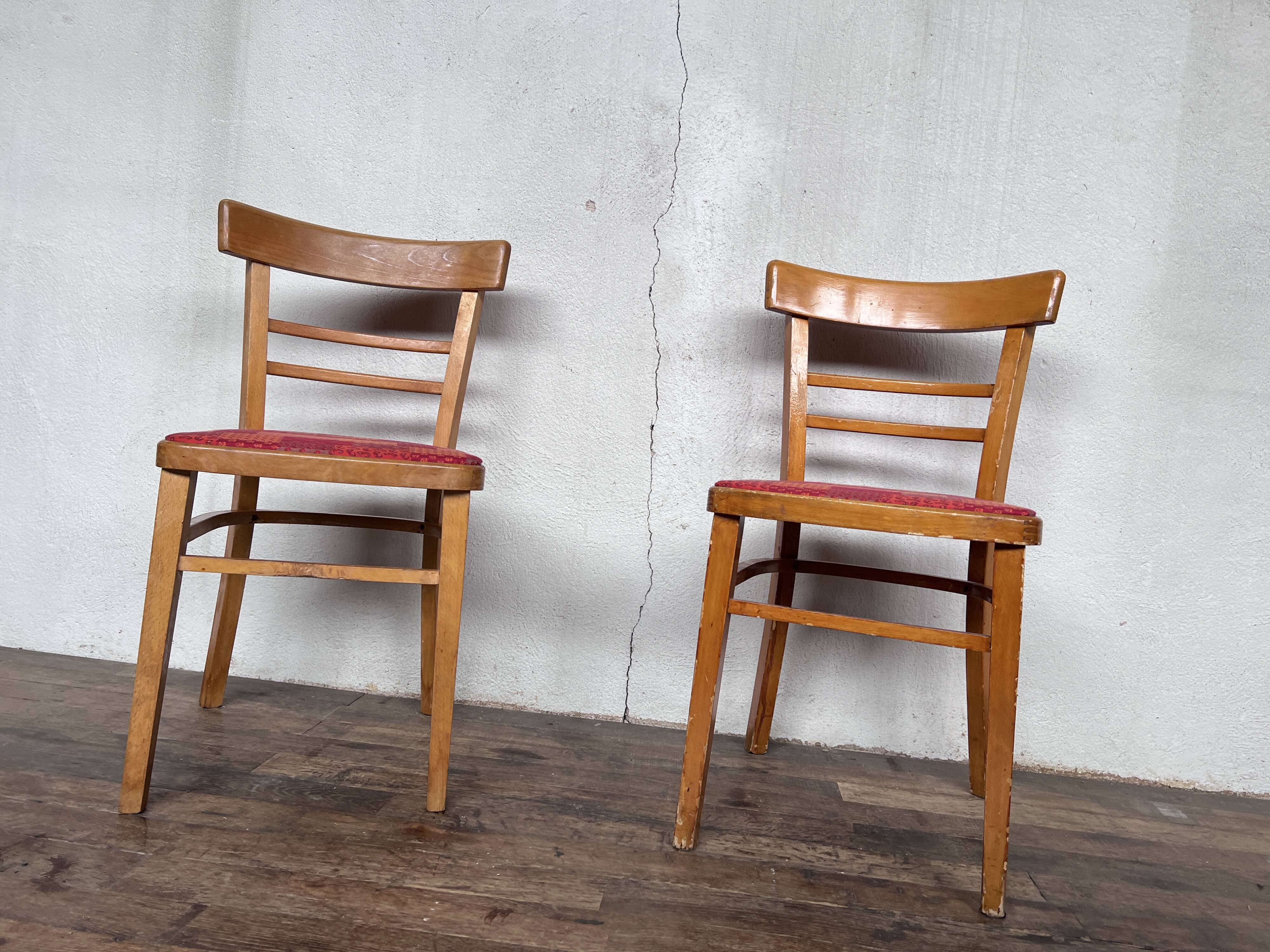 Pair of chairs in light wood and vintage red fabric 1960