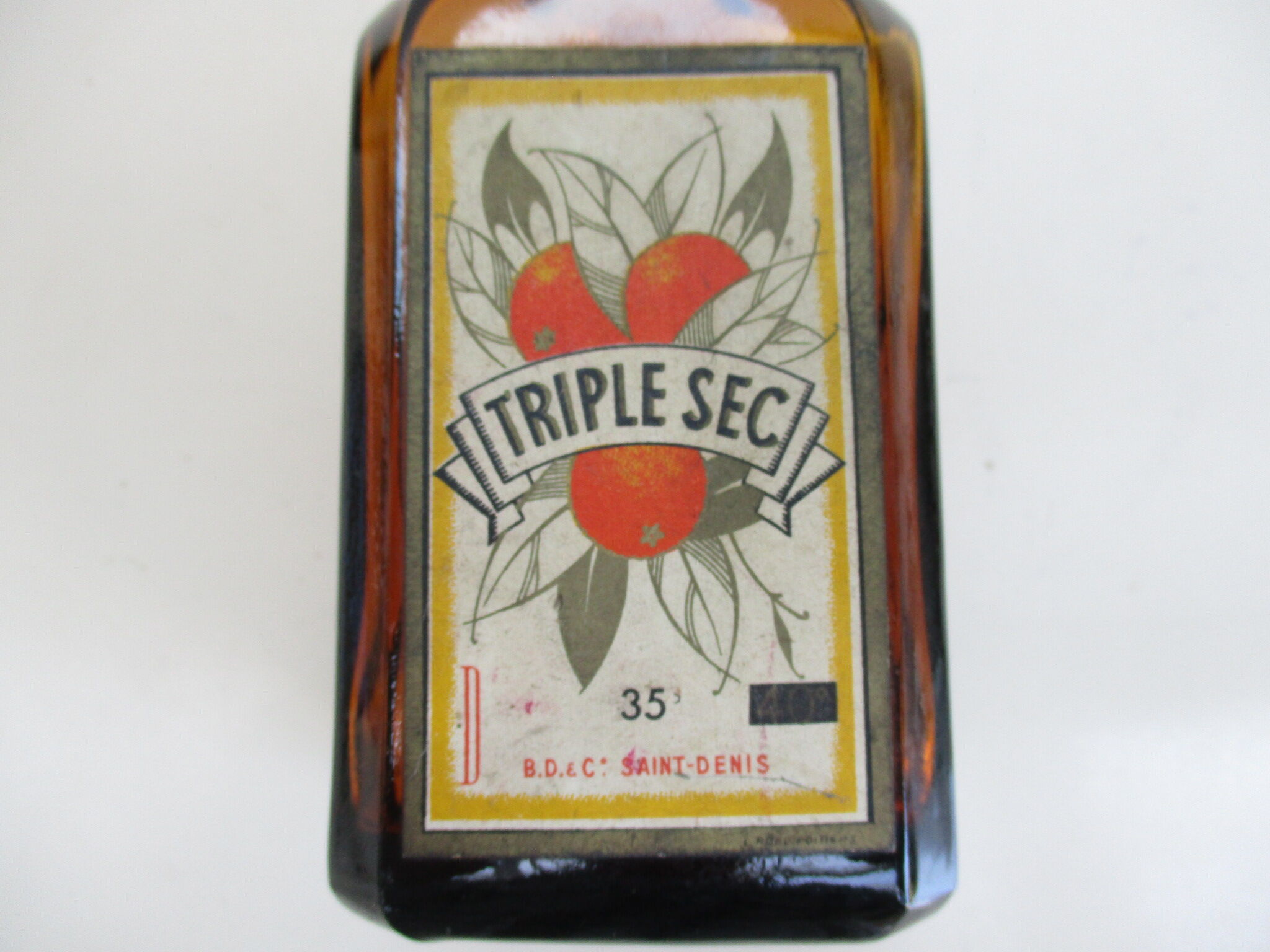 2 amber glass bottles with their old labels