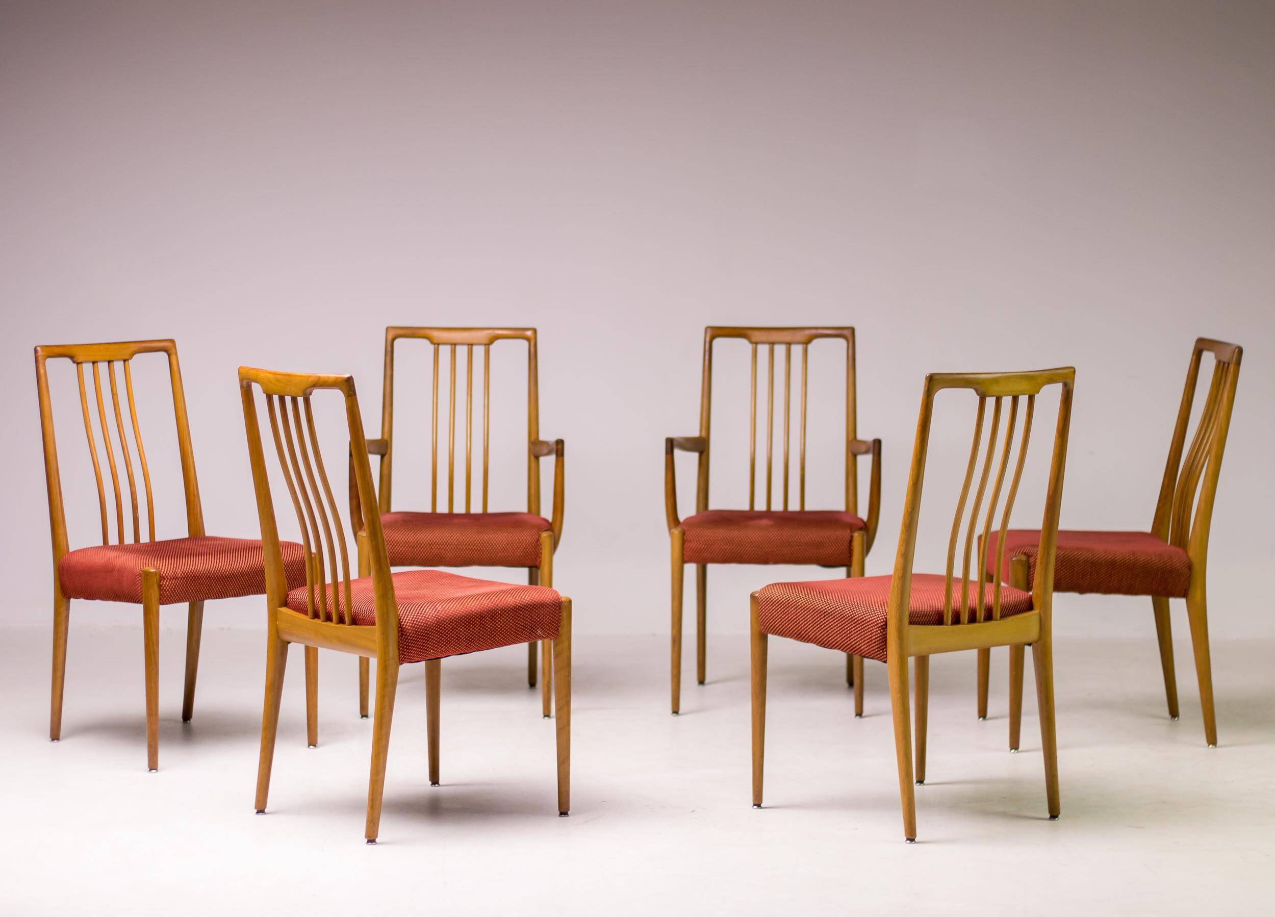 Set of six carved walnut dining chairs, Italy, 1955