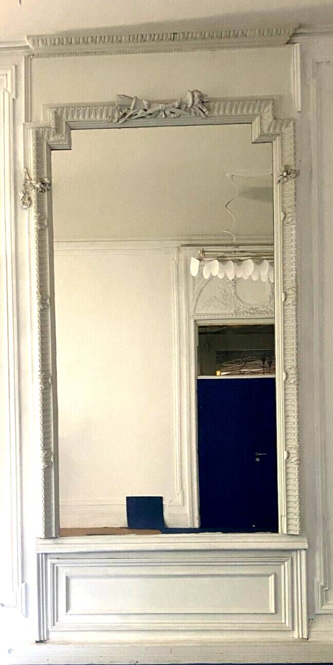 Louis XVI style mirror in wood and carved stucco 20th century