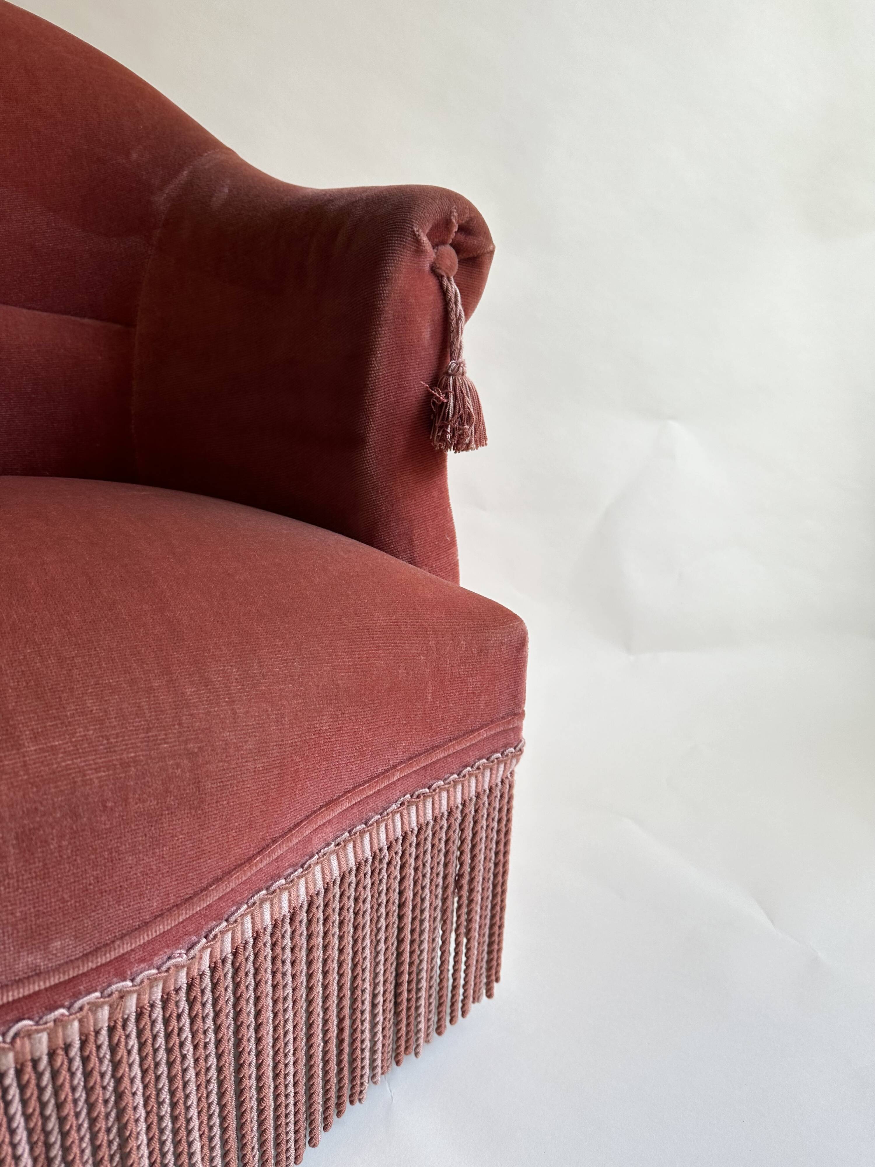 Pink-orange velvet tub chair