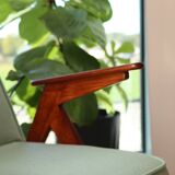 Vintage armchair in mint green wool, mid-century modern design.